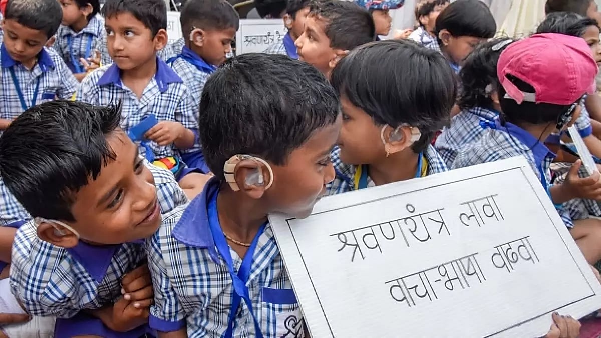 Students of deaf school 'Swarnaad' take part in an awareness rally about impaired hearing