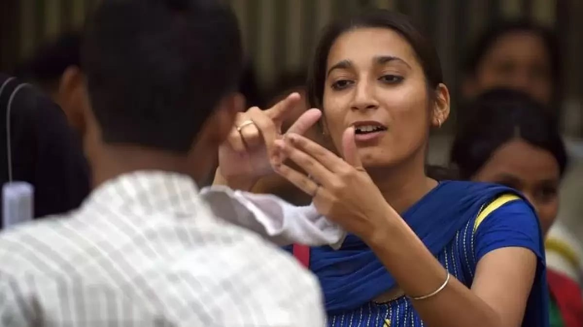 A person speaking in Indian Sign Language (ISL) during a protest in Delhi