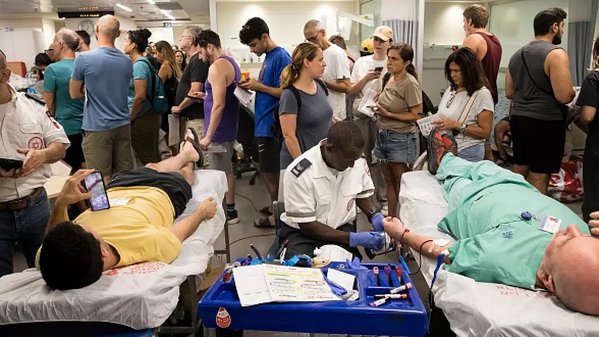 Israelis donate blood in Tel Aviv's Sourasky Medical Center as officials called upon the public to donate blood in the wake of the all-out offensive mounted by the Palestinian terrorist group Hamas on Israel. (Photo: Getty Images)