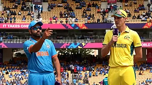 Rohit Sharma (L) and Pat Cummins at the toss in Chennai on Sunday.
