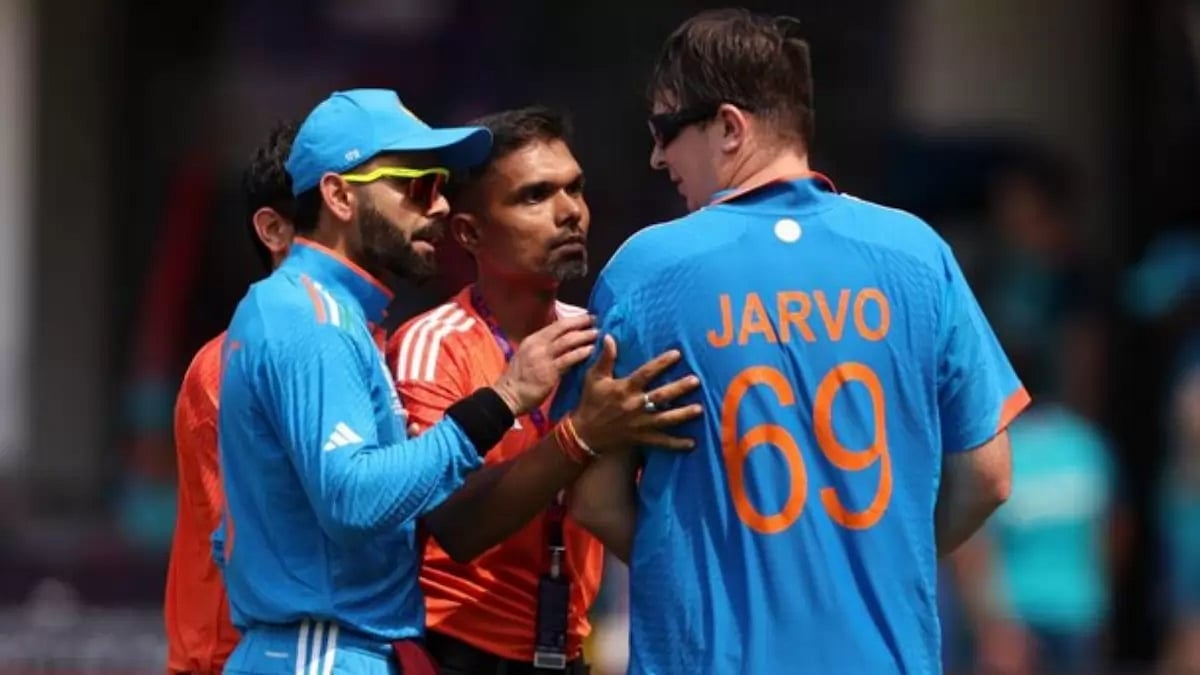 Virat Kohli (left) interacts with Jarvo on the field