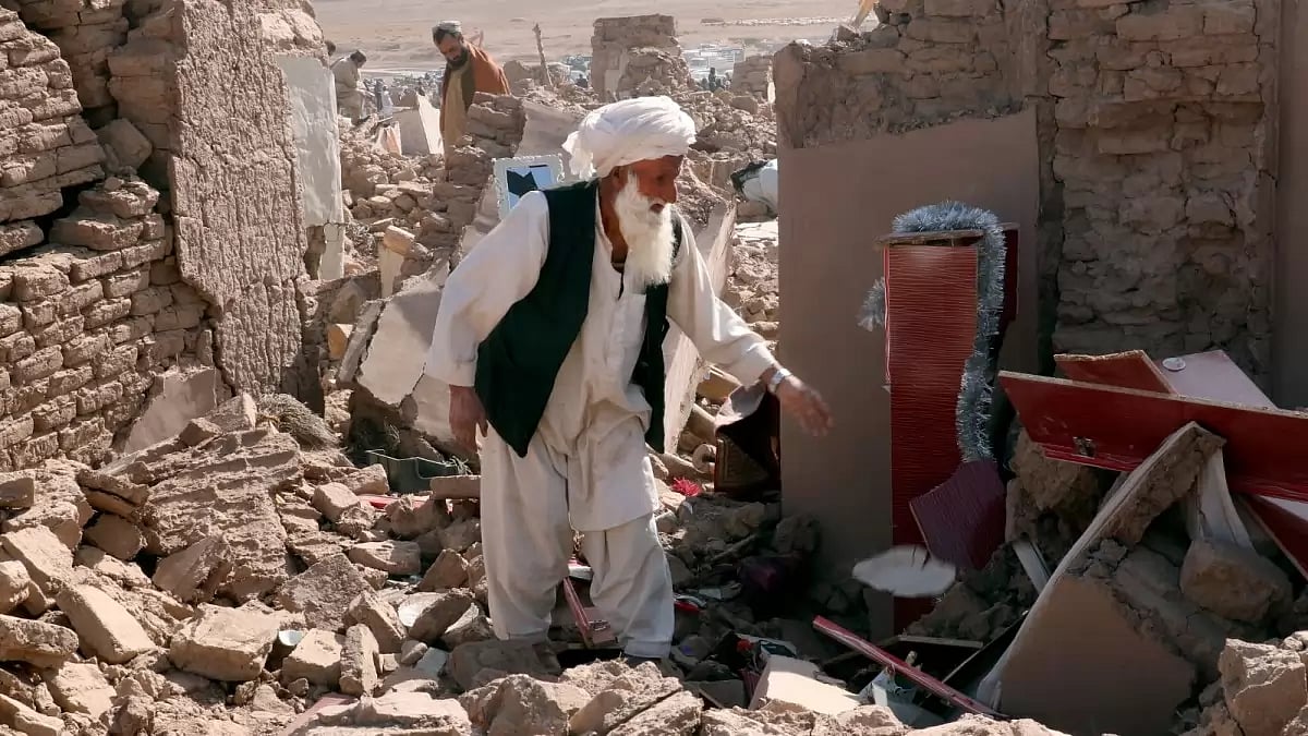 A man cleans up after an earthquake in Zenda Jan district in Herat province, Afghanistan.