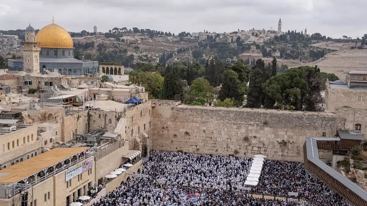 Jews take part in priestly blessing during the weeklong holiday of Sukkot in front of the Western Wall, the holiest site of Jews in Jerusalem. (AP Photo/Ohad Zwigenberg)