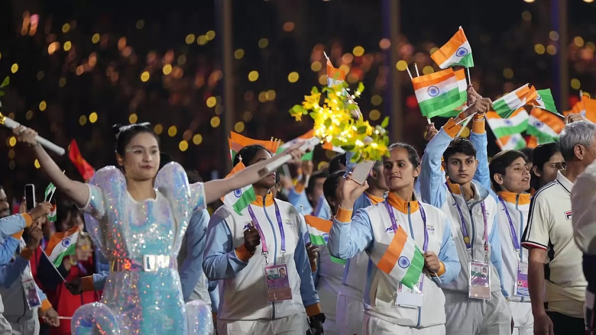 An Indian contingent walks through the arena during the closing ceremony of the 19th Asian Games
