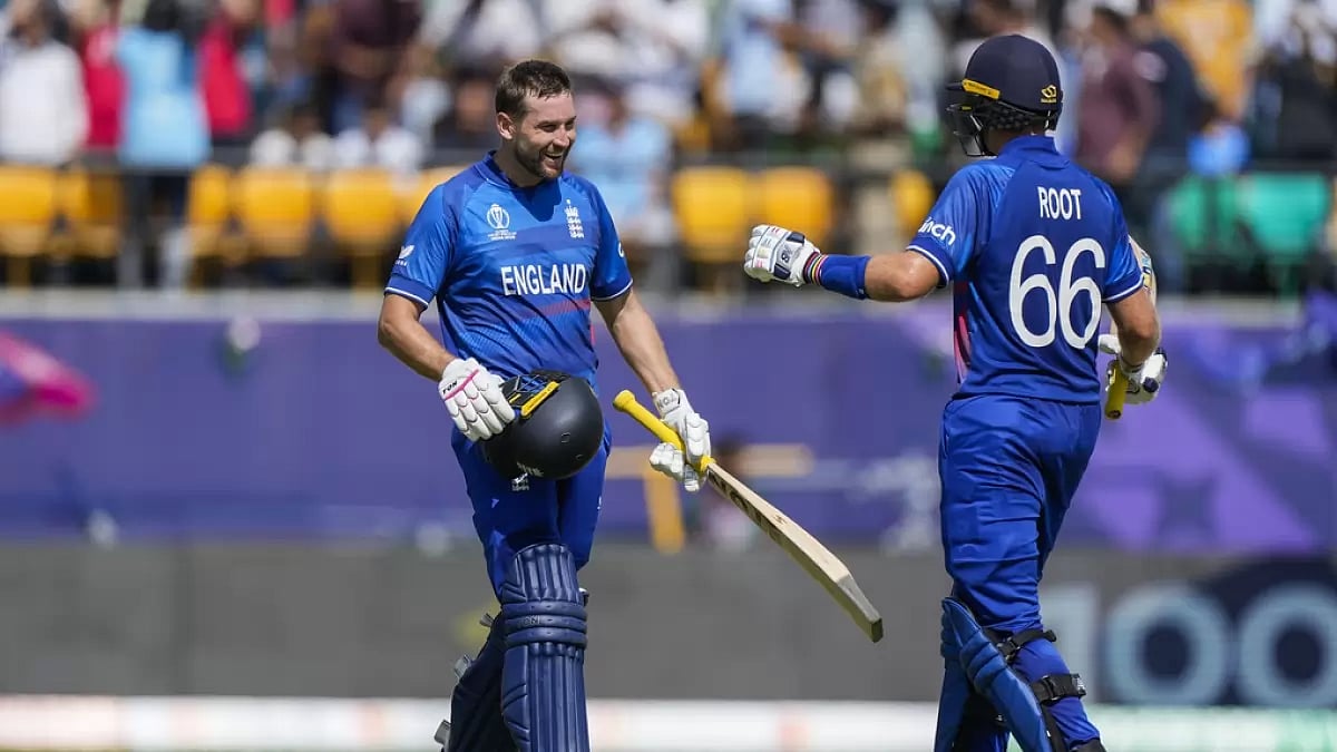 Dawid Malan (L) celebrates his ton with Joe Root during the match against Bangladesh in Dharamsala.