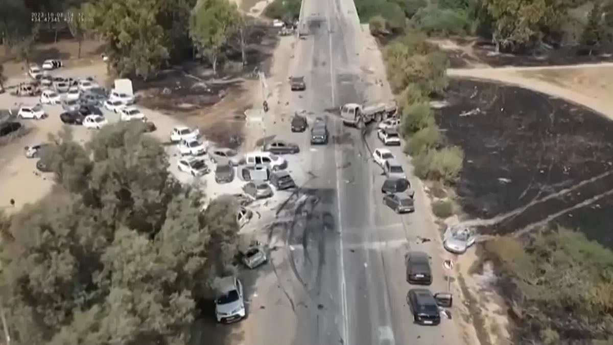 Aerial footage of charred and bullet-riddled cars at the site of Supernova Music Festival in Israel, where at least 260 people were killed by Hamas.