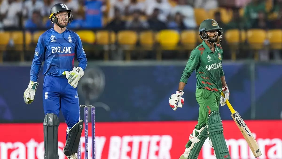 Bangladesh's Towhid Hridoy (R) leaves the ground after losing his wicket