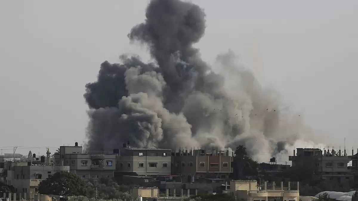 Smoke rises from an explosion caused by Israeli airstrikes on the border between Egypt and Rafah, Gaza Strip.