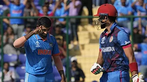 Jasprit Bumrah (L) celebrates after dismissing Afghanistan's Ibrahim Zadran in Delhi on Wednesday.