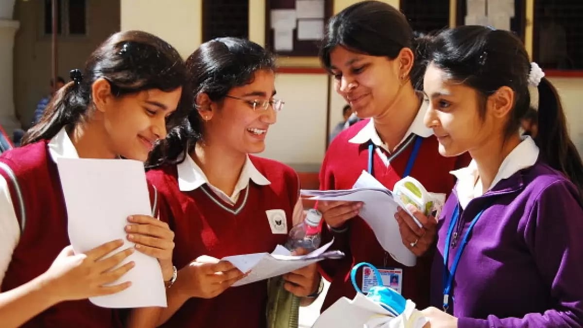 Students evaluating their question paper after giving their CBSE exams