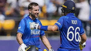 England's Dawid Malan (L) and Joe Root during the match against Bangladesh in Dharamsala.