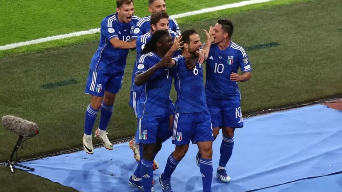 Italian players celebrate a goal against Malta
