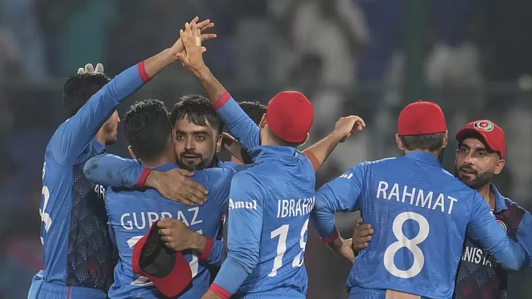 Afghanistan celebrate their remarkable win over England in Delhi. - null