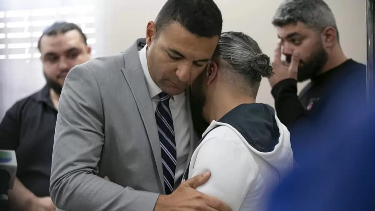 Execexutive director of Council on American Islamic Relations embraces father of the boy killed