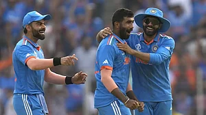 Virat Kohli, Jasprit Bumrah and Ravindra Jadeja celebrate Shadab Khan's wicket in Ahmedabad.