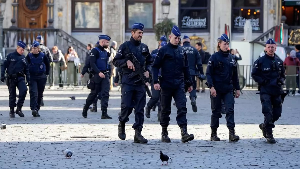 Belgian Police patrol the Grand Place in central Brussels following the killing of two Swedish football fans by a suspected Tunisian ISIS terrorist. (AP Photo/Martin Meissner)