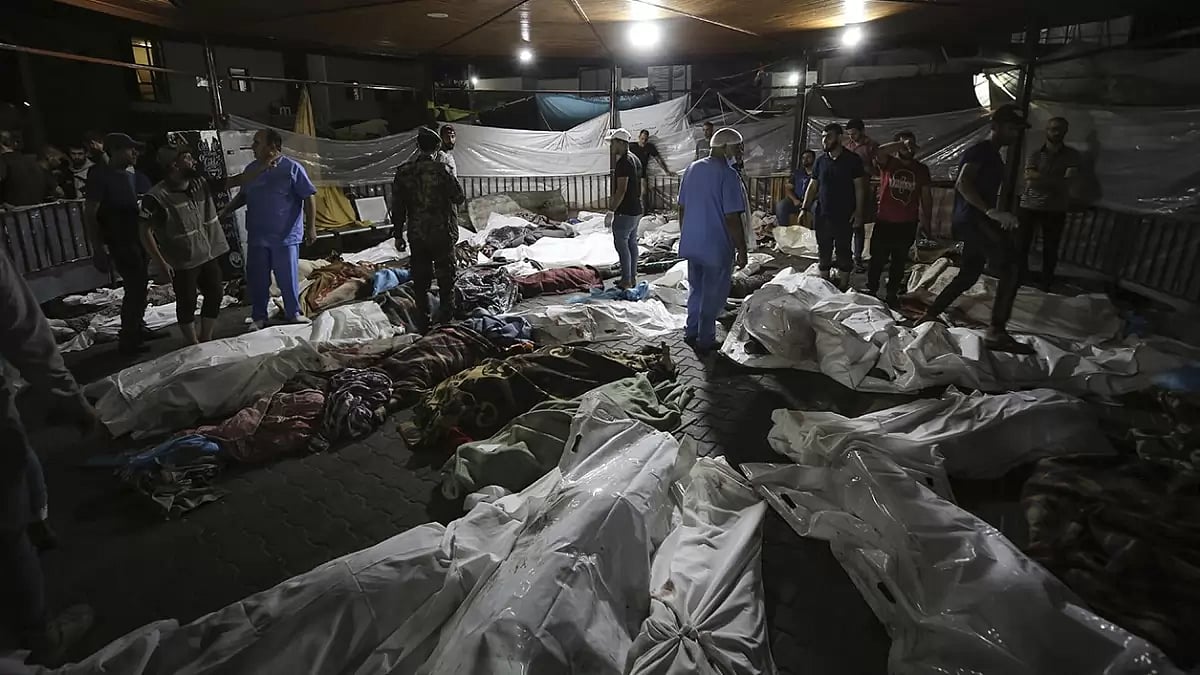Bodies of Palestinians killed by an explosion at the Ahli Arab hospital 