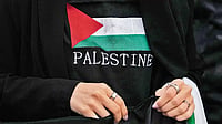 Books On Palestine: A Reading List To Understand Palestinian History, Politics And Culture Hand in Hand: A woman protests against Israeli air strikes on Gaza in Madrid, Spain