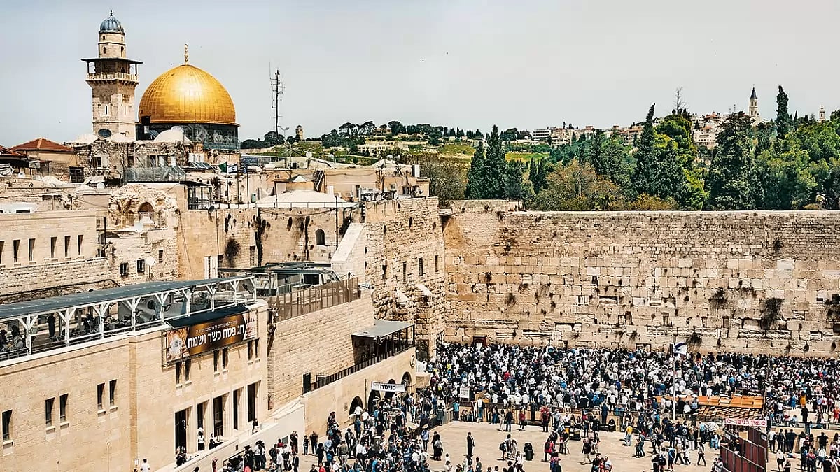 Postcards of Prayer: The Wailing Wall in Jerusalem, where hundreds of letters to God, written by people from all religions, are sorted out and placed between the cracks of the Wall every day