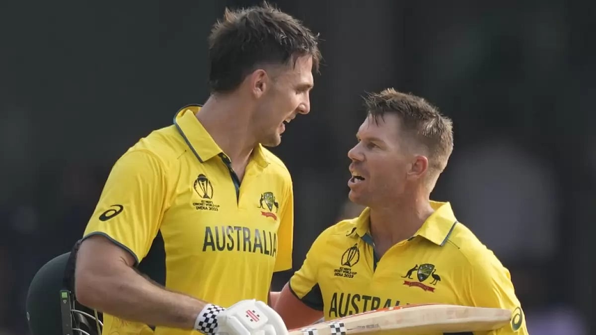 Mitchell Marsh (L) and David Warner celebrate their milestones against Pakistan in Bengaluru.