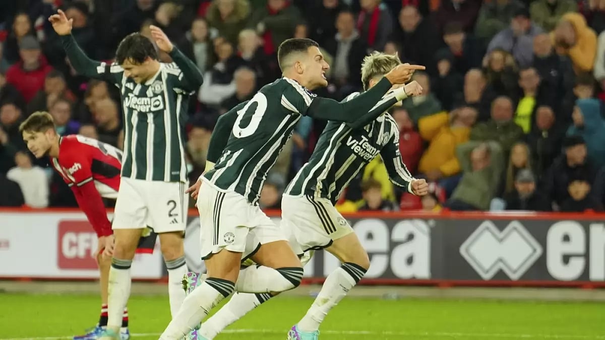Manchester United's Diogo Dalot, centre, celebrates after scoring his side's second goal