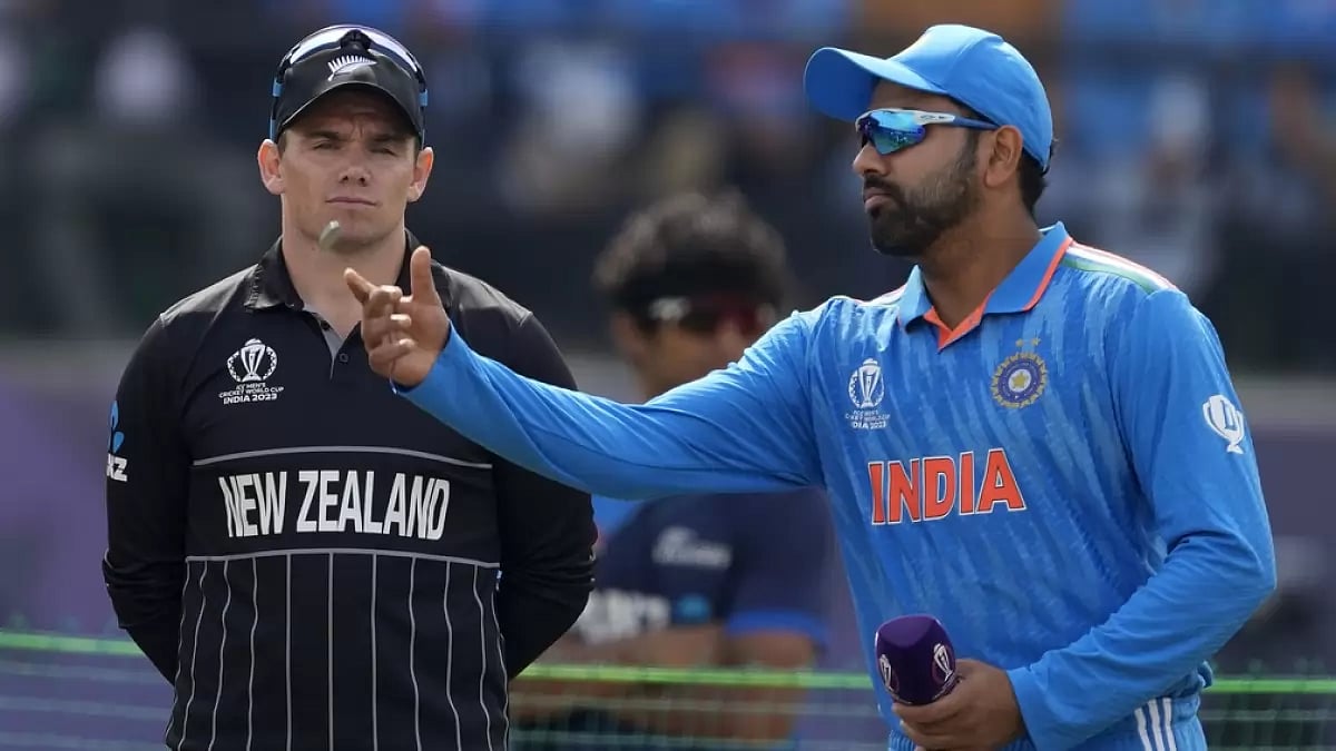 India captain Rohit Sharma (right) flips the coin at the toss as NZ skipper Tom Latham watches on