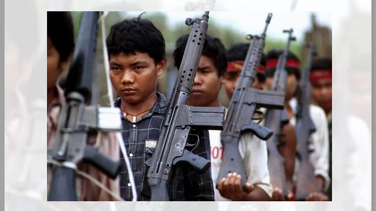 The Karen Guerilla growing out Of childhood with a gun in hand on January 12th, 1988, Myanmar. 