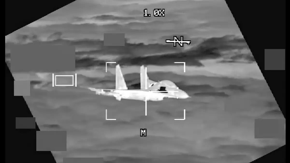 A People’s Republic of China J-11 is seen from a U.S. Air Force B-52 aircraft, over South China Sea