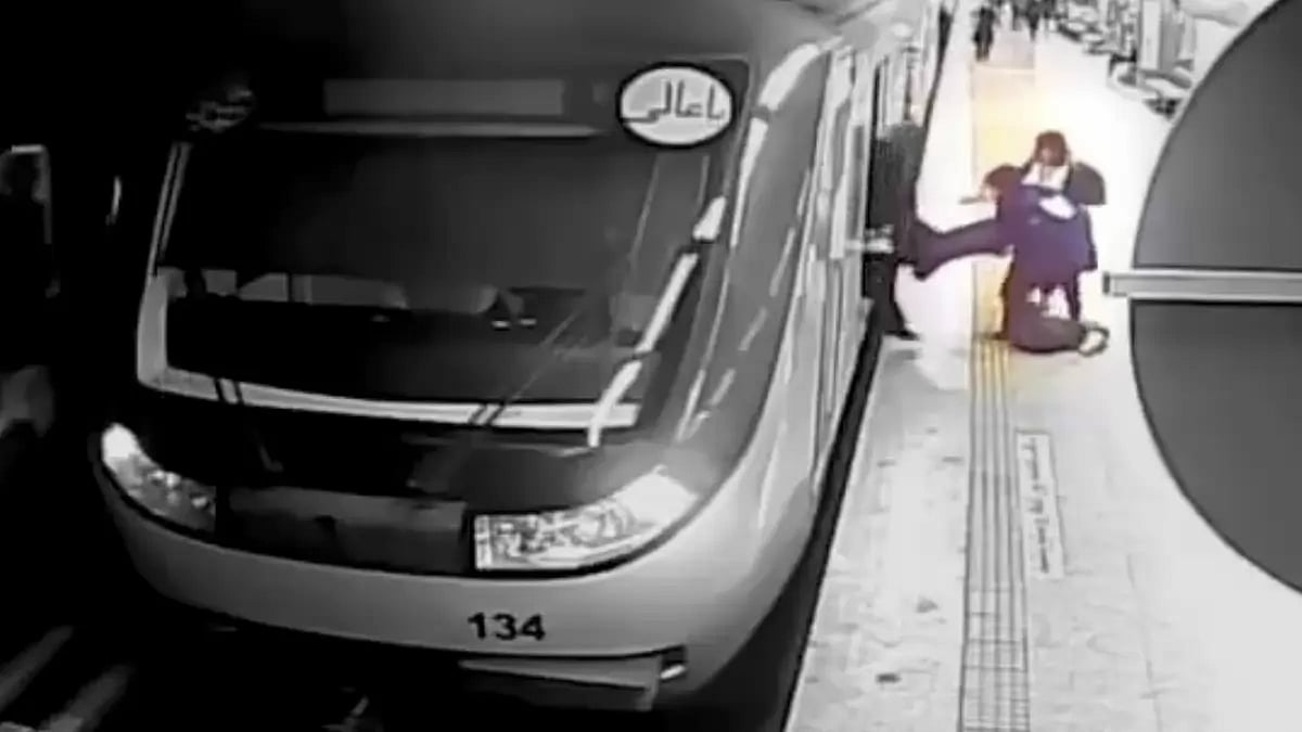 In this image from surveillance video aired by Iranian state television, women pull 16-year-old Armita Geravand from a train. The Iranian state media has reported that she has died from her injured. (AP Photo/Iranian state television, File)