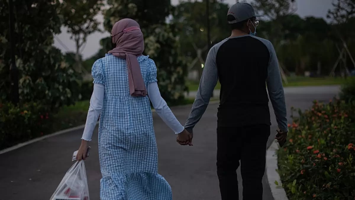 A couple holding hands