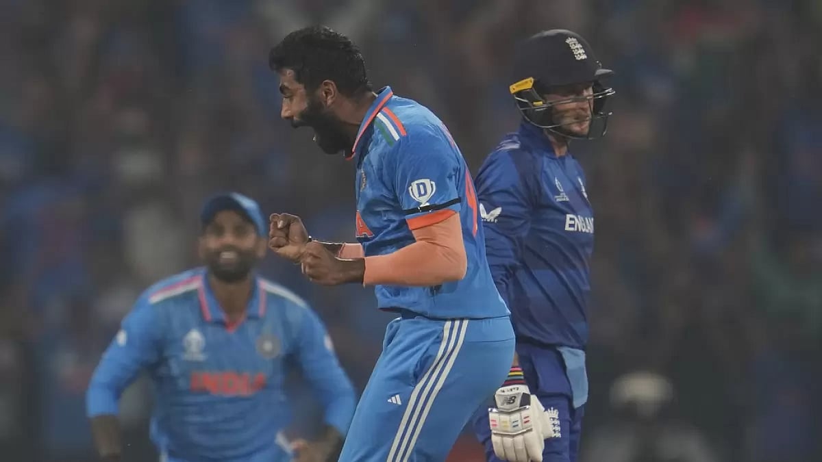 Jasprit Bumrah (L) exults after dismissing England's Joe Root in Lucknow.