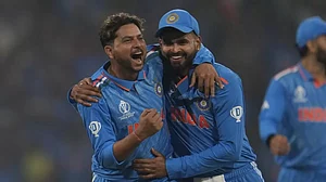 Kuldeep Yadav (L) celebrates the wicket of Jos Buttler in Lucknow.