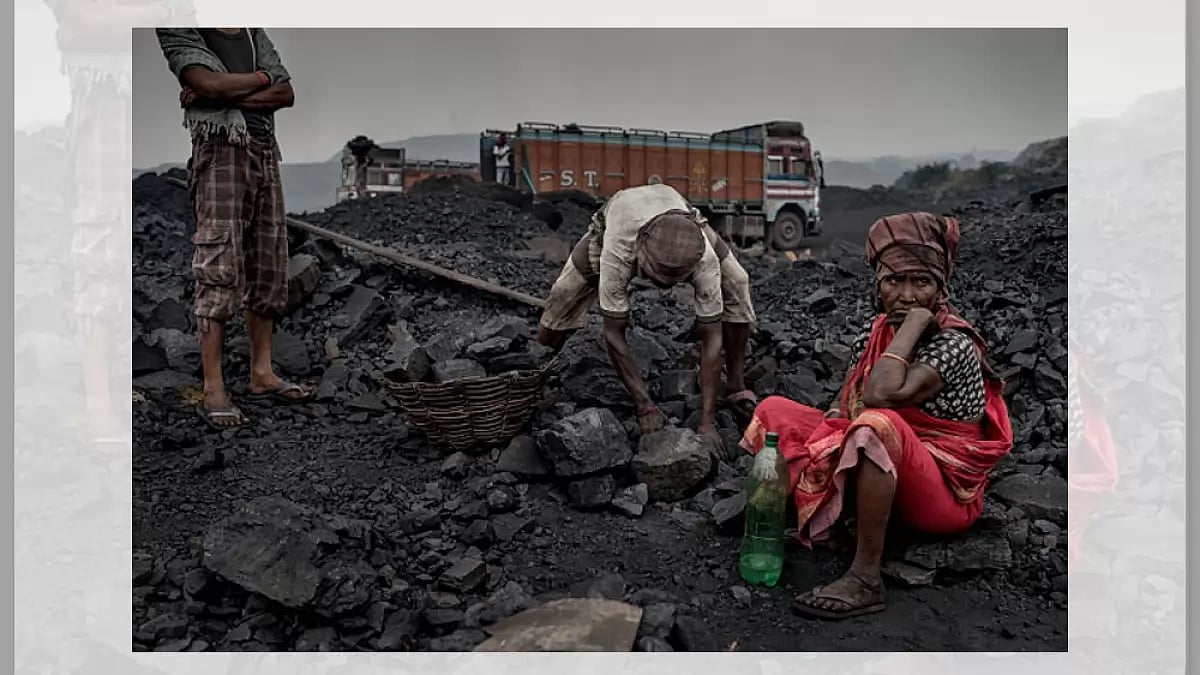 Workers panning through the coal mines in Jharia, Jharkhand - File image
