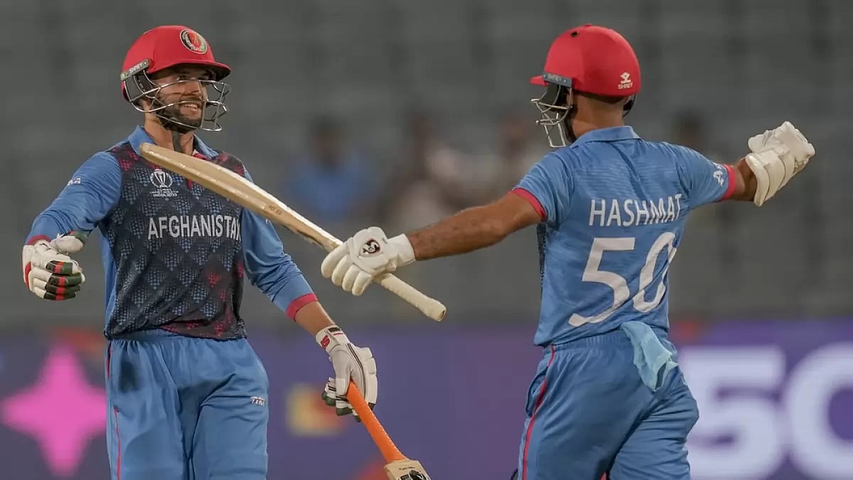 Azmatullah Omarzai, left, celebrates his fifty runs during the ICC Men's Cricket World Cup.