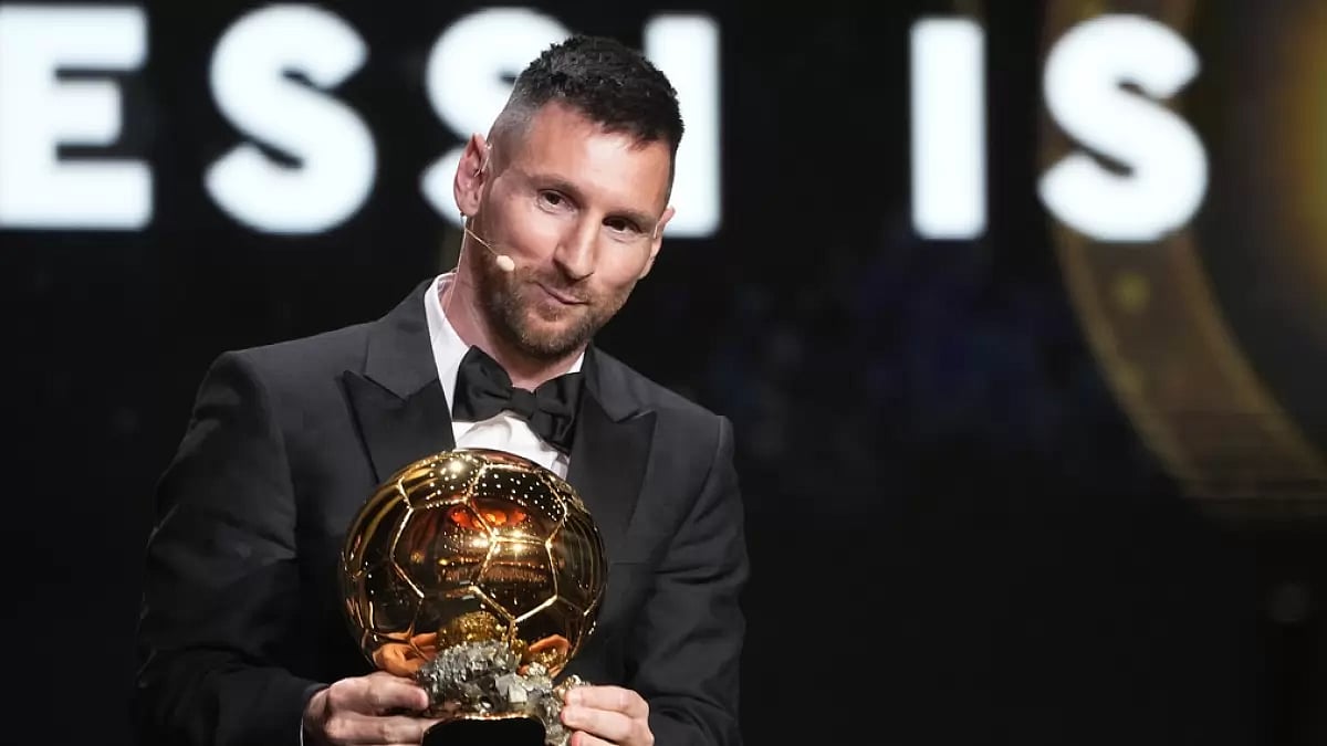 Lionel Messi poses with his Ballon dOr trophy in Paris.