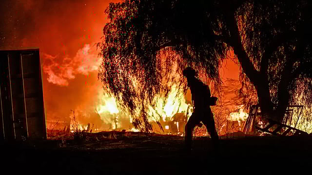 Wildfire Driven By Santa Ana Winds Forces Thousands To Flee Homes In Southern California