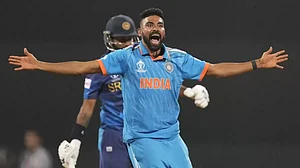 Mohammed Siraj celebrates the wicket of Sri Lanka's Dimuth Karunaratne in Mumbai.