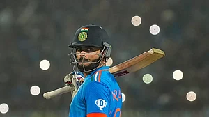 Virat Kohli reacts after his century against South Africa in the 2023 ODI World Cup.