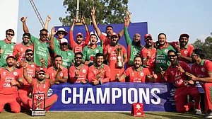 The victorious Oman pose with the ICC Men's T20 World Cup Asia Qualifier Final trophy in Kirtipur.