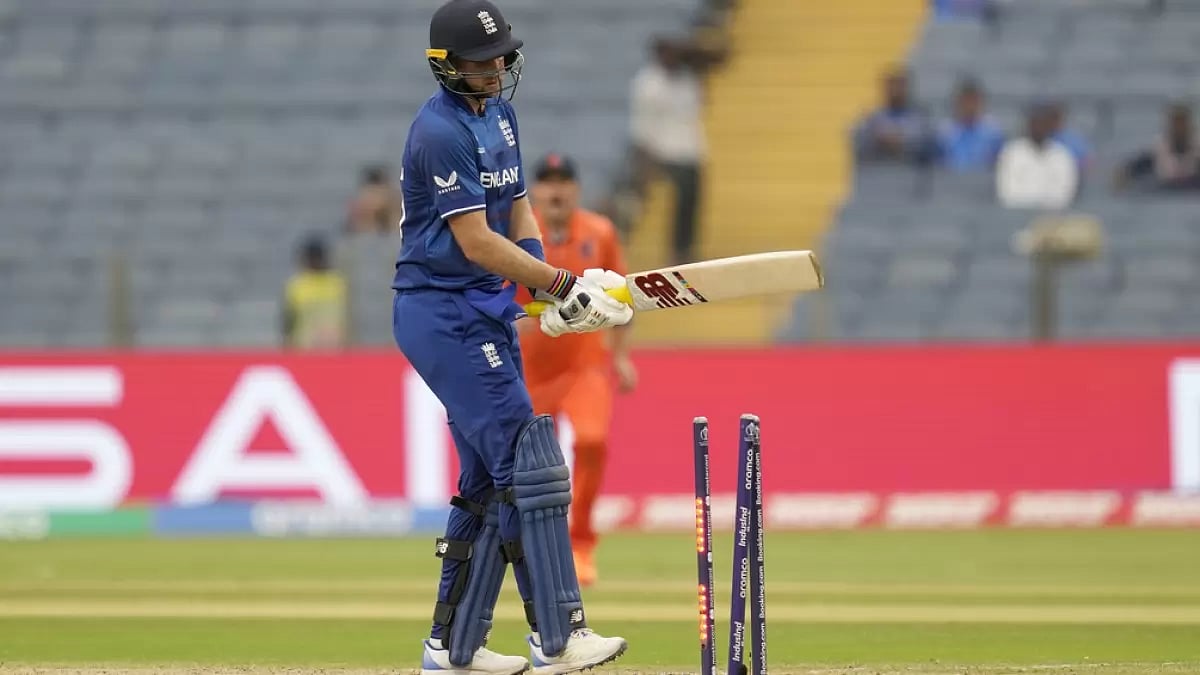 Joe Root reacts after being bowled in Pune