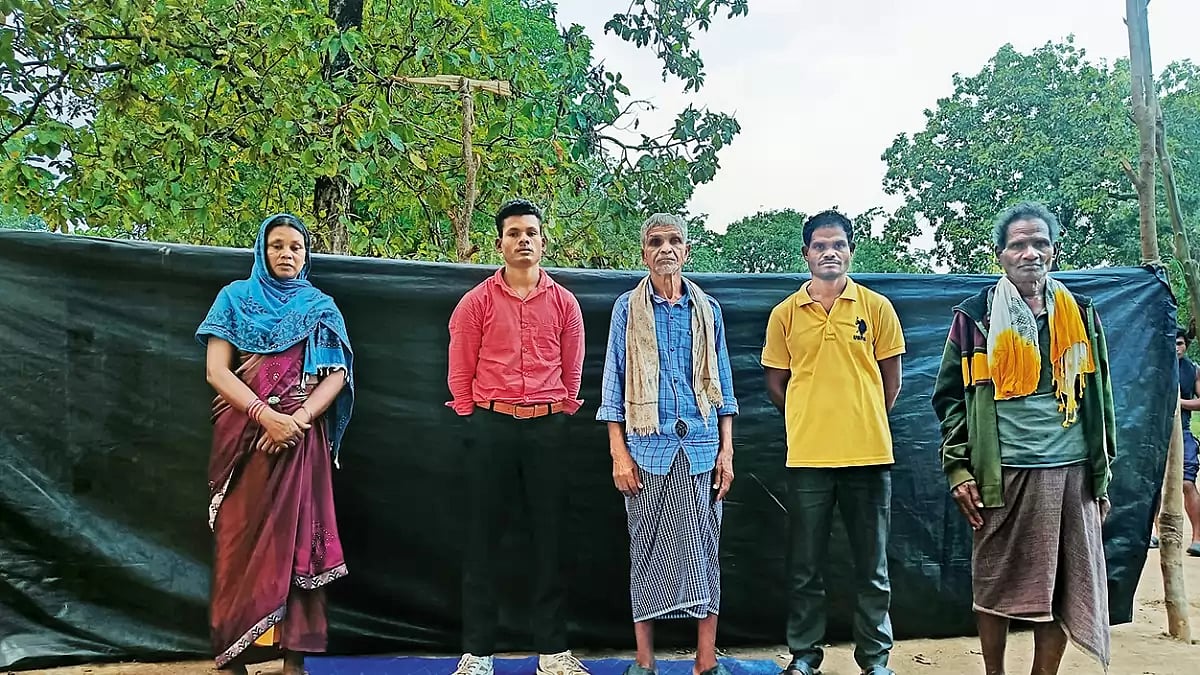 Free At Last: Shankar Podiyami (in red shirt) with his family after being released by the Maoists 