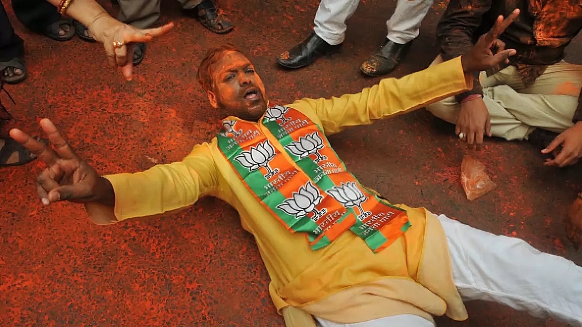 BJP supporters celebrating Holi after the announcement of Uttar Pradesh Assembly election results.