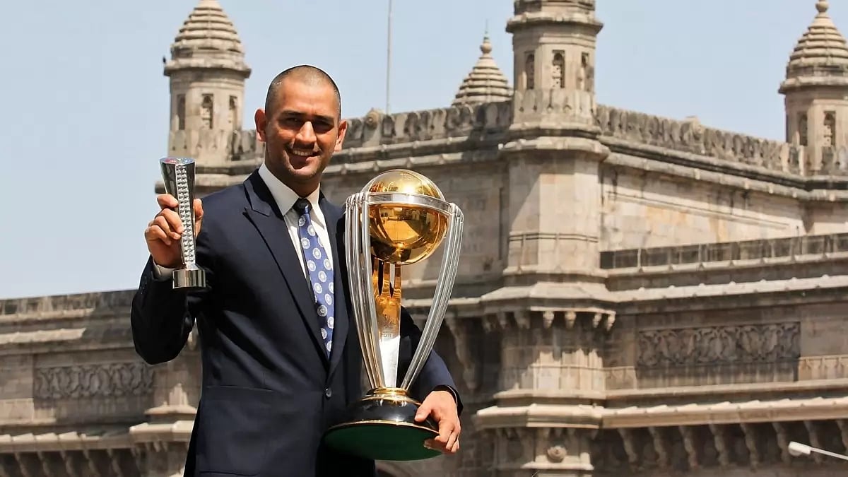 MS Dhoni posing with the 2011 World Cup trophy.