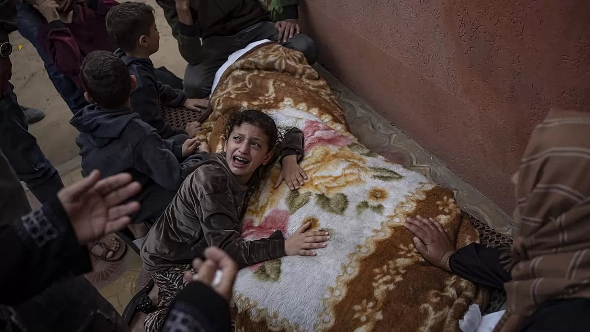 Palestinians mourn their relatives killed in the Israeli bombardment of the Gaza Strip
