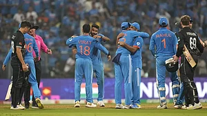 Indian players celebrate the win after bowling out the Kiwis for 327
