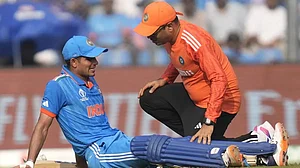 Shubman Gill being treated after suffering from cramps in the 2023 World Cup semi-final in Mumbai.
