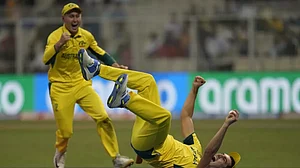 Pat Cummins (R) celebrates his superb catch of Quinton de Kock in the 2023 ODI World Cup.