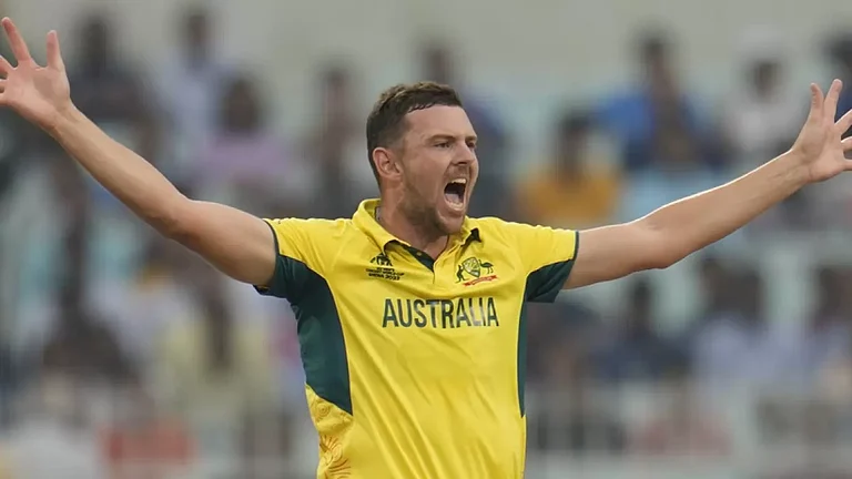 Josh Hazlewood celebrates the wicket of Quinton De Kock during the ICC World Cup second semifinal match between Australia and South Africa. - File
