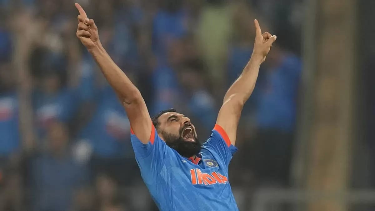 Mohammed Shami celebrates the wicket of Daryl Mitchell during the ICC  World Cup first semifinal match between India and New Zealand.