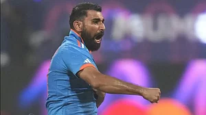 Mohammed Shami celebrates the wicket of Rachin Ravindra in the first semifinal match between India a